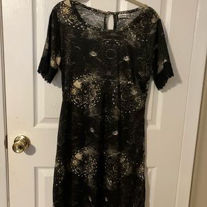 Black with design dress it comes above the knee